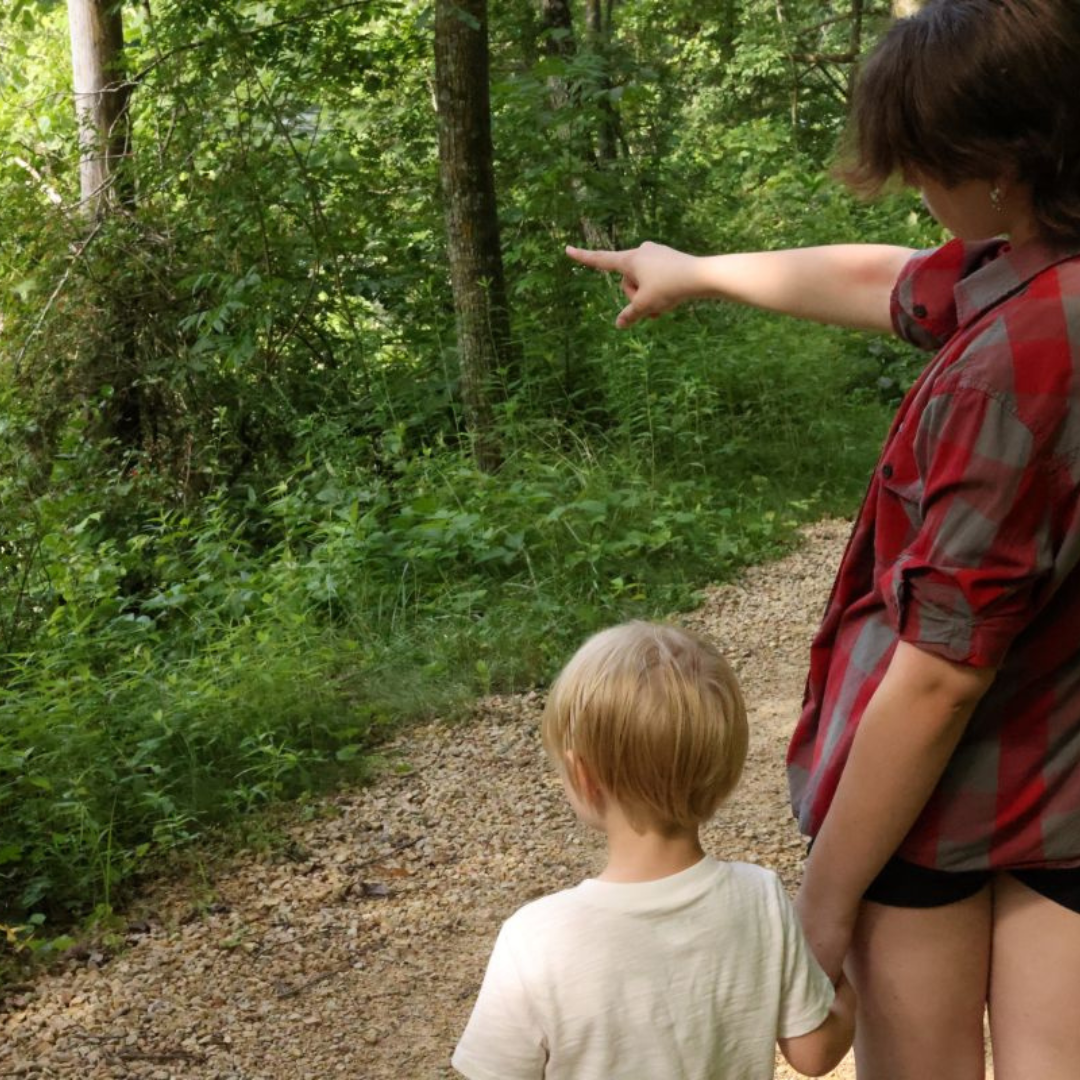 A mother and her son hiking and admiring the view in Viroqua